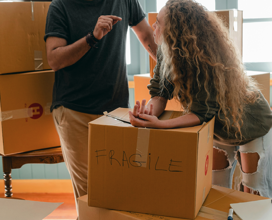 couple packing up boxes